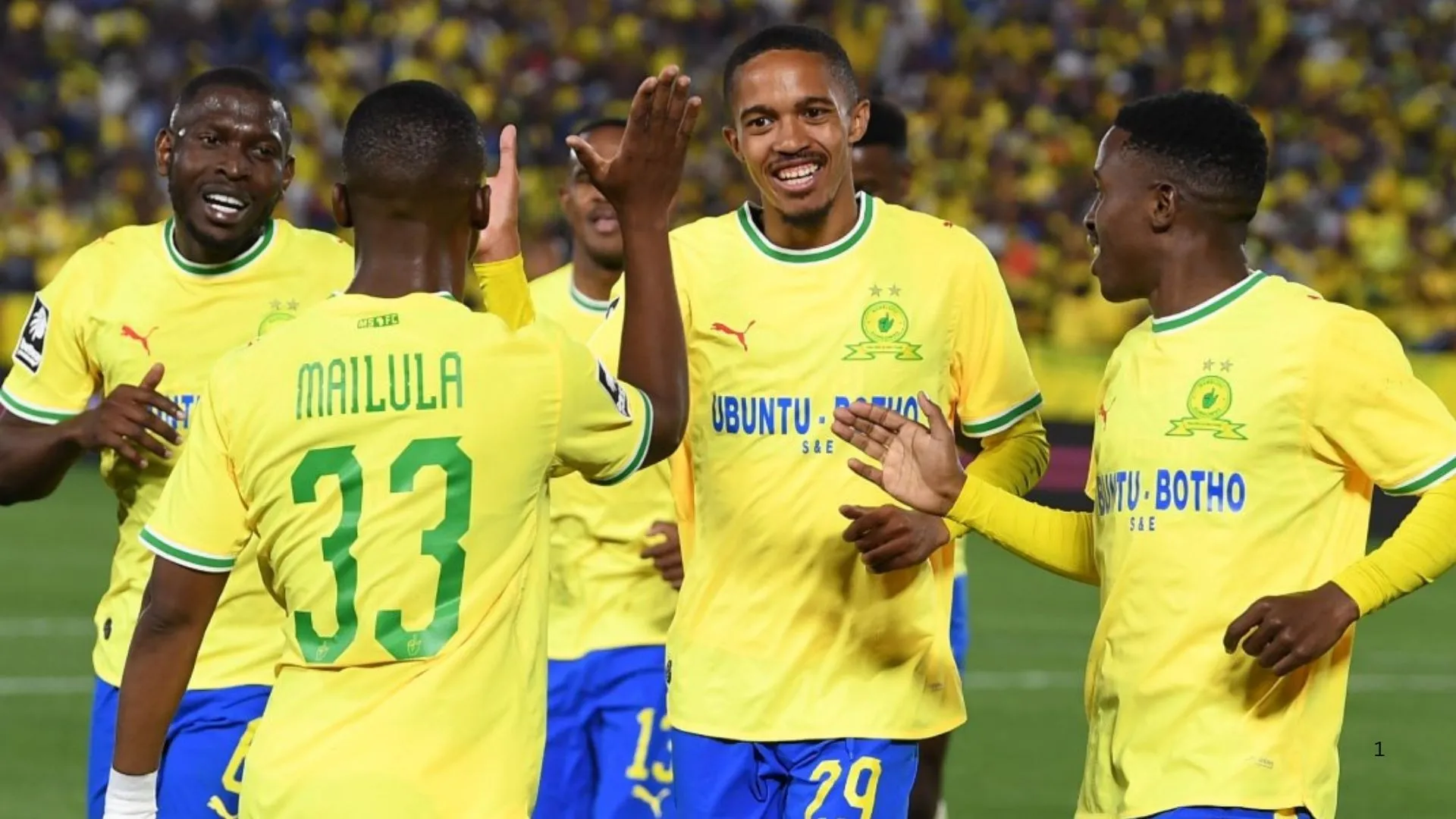 Cassius Mailula, Antonio van Wyk and Aubrey Modiba of Mamelodi Sundowns celebrate a goal.