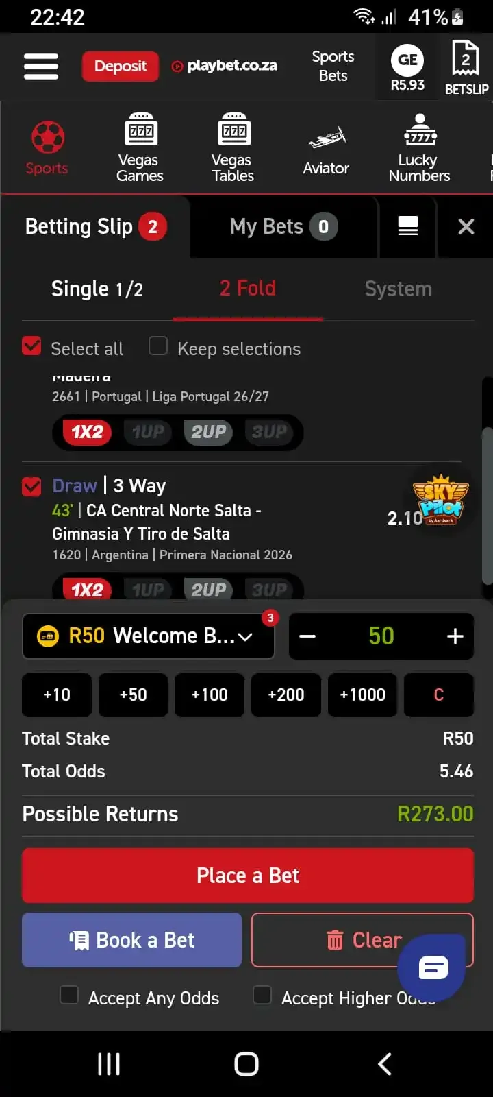 Playbet mobile betslip interface displaying 2 Fold selection, wallet dropdown, stake buttons, odds, and Place a Bet button.