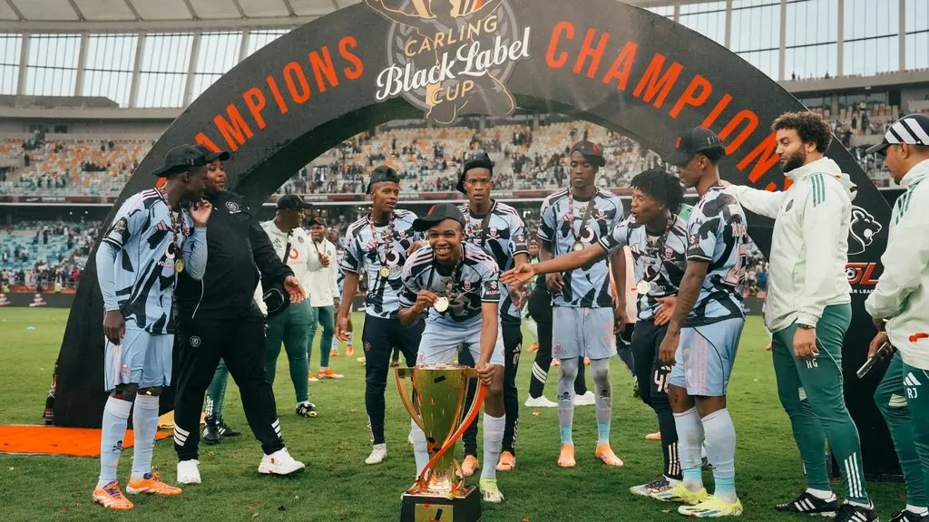 Orlando Pirates players celebrate Carling Black Label Cup glory.