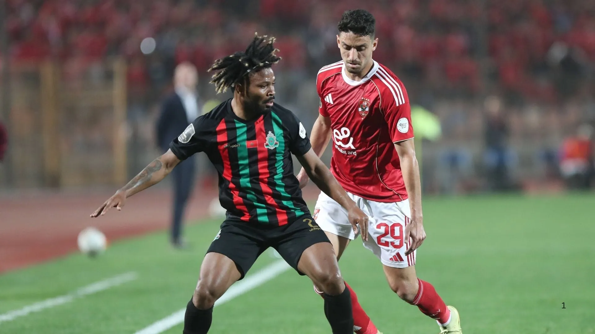 Rabat Taher Mohamed (R) of Al-Ahly in action against Augusto De Jesus of As Far Rabat