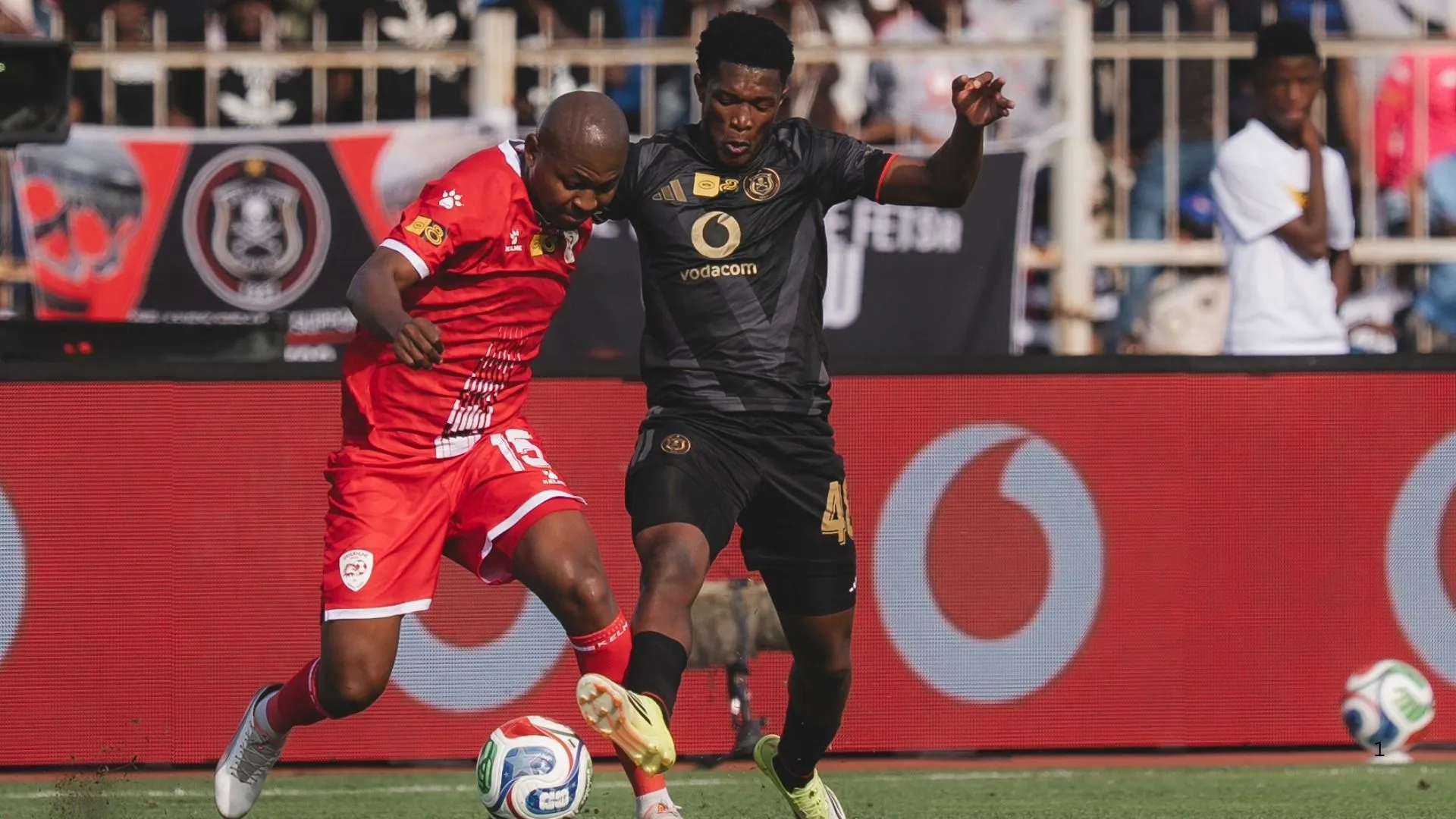 Simphiwe Masilela of Orlando Pirates (right) vies for the ball with Siphesihle Mkhize of Sekhukhune United in their MTN8 semi-final.