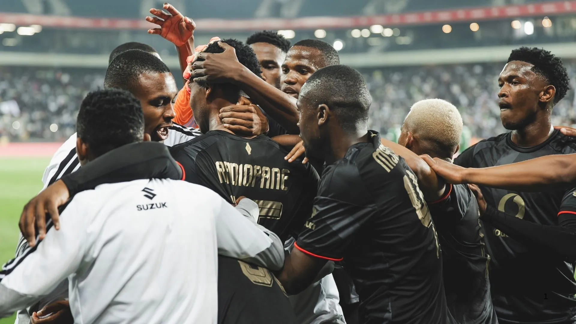 Orlando Pirates players congratulate Boitumelo Radiopane after scoring against Sekhukhune United.