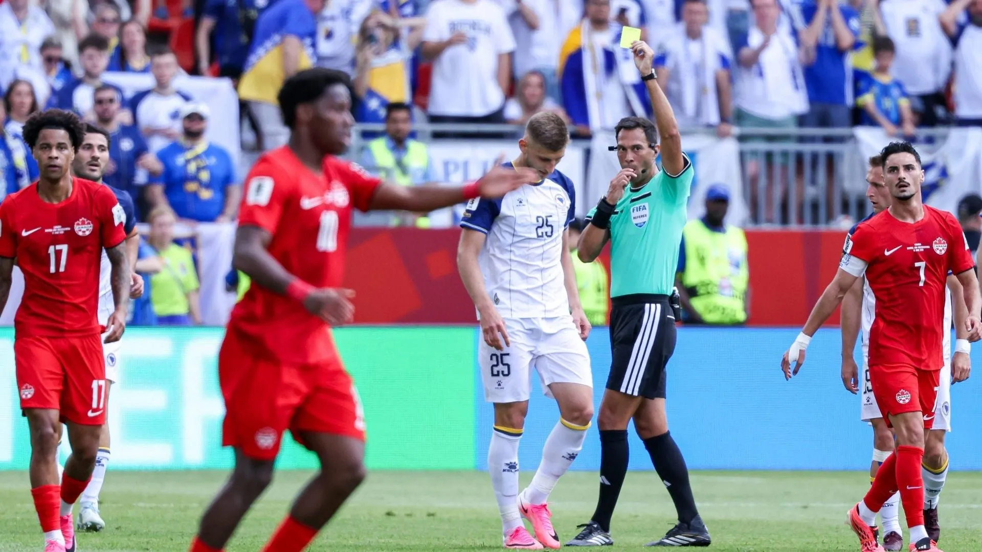 Facundo Tello booking a player during Canada vs Bosnia match.