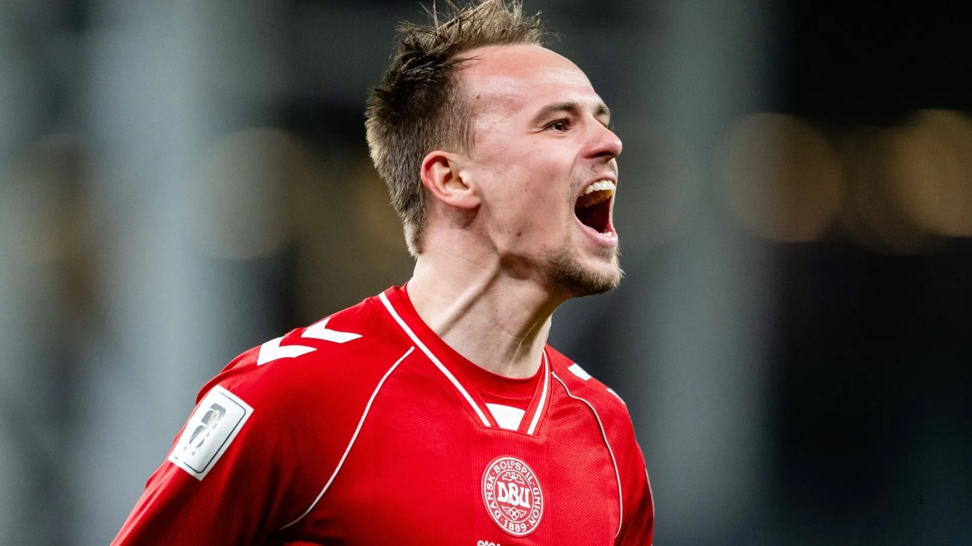 Mikkel Damsgaard of Denmark celebrates his goal against North Macedonia.