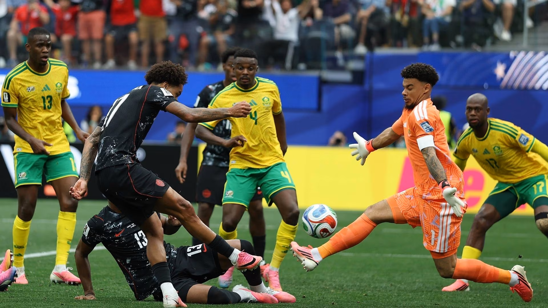 South Africa goalkeeper Ronwen Williams keepers out an effort from Tajon Buchanan of Canada.