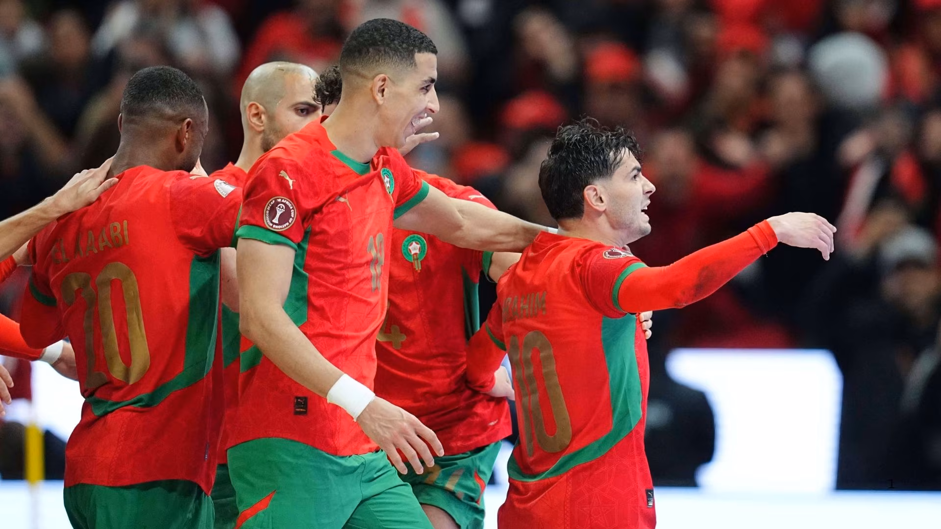 Morocco players celebratea goal.  