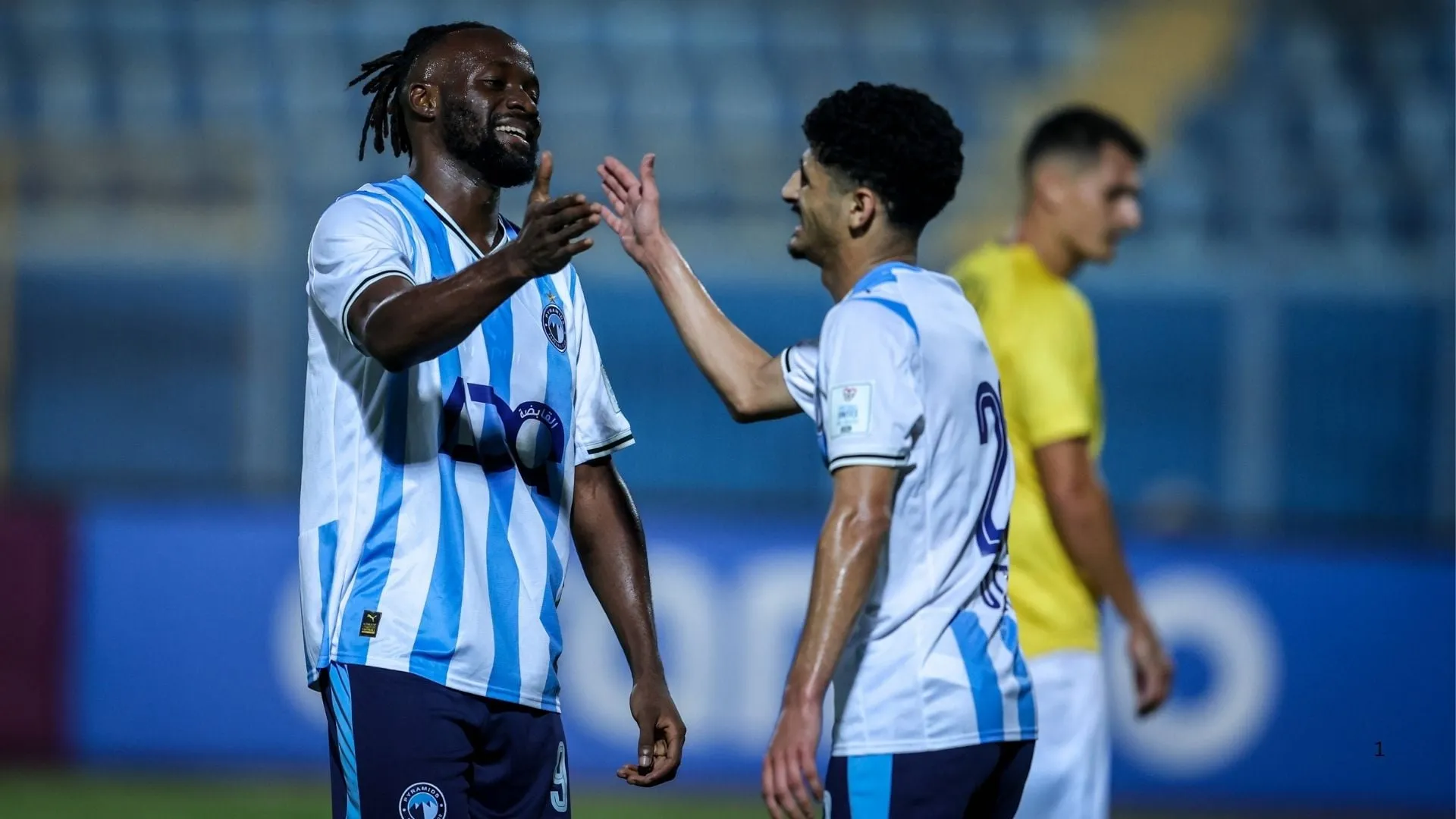 Fiston Mayele and Mohamed Hamdi of Pyramids