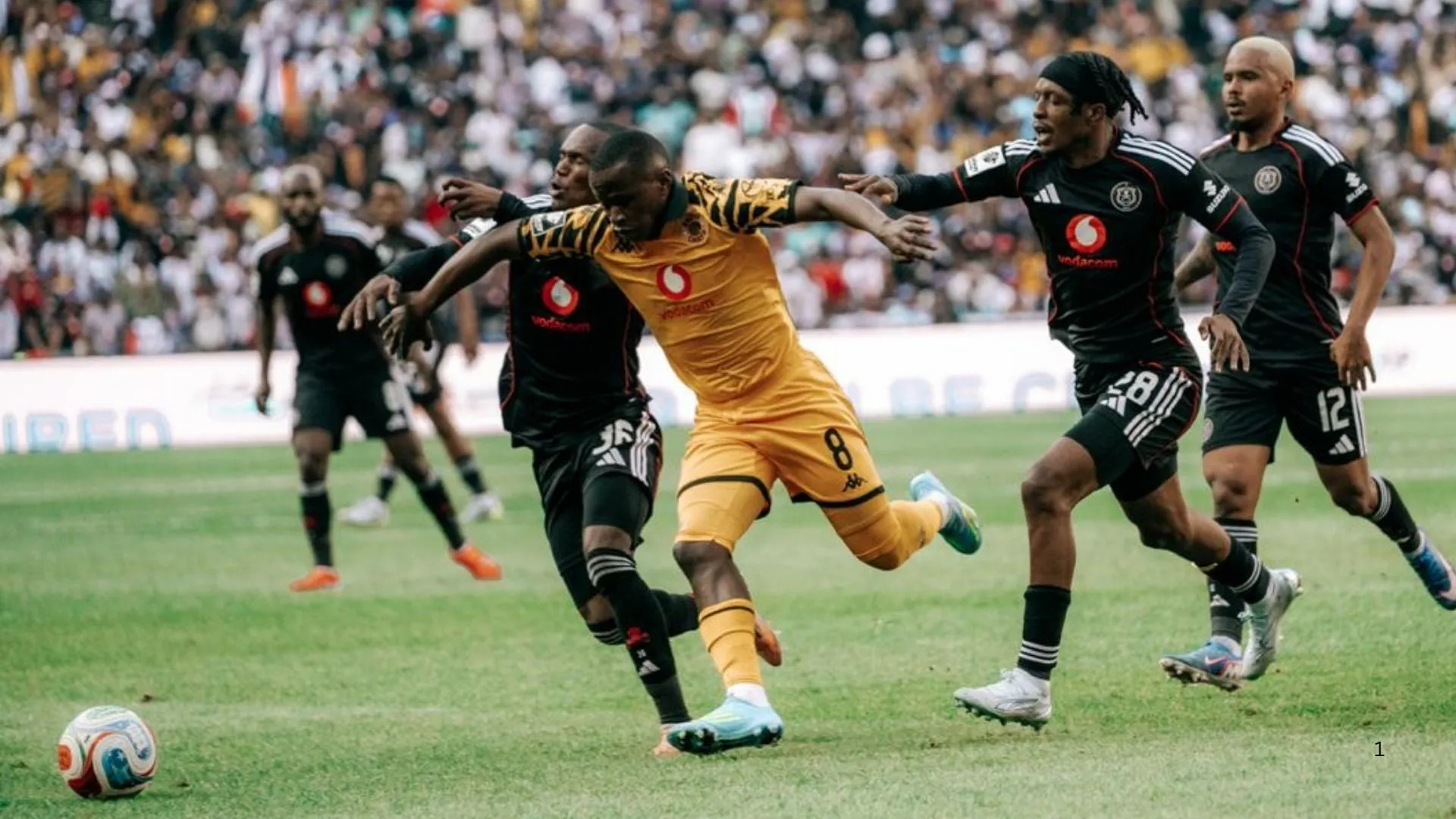 Siphesihle Ndlovu of Kaizer Chiefs vies for the ball with Orlando Pirates' Kamogelo Sebelebele and Patrick Maswangannyi in the Soweto Derby.