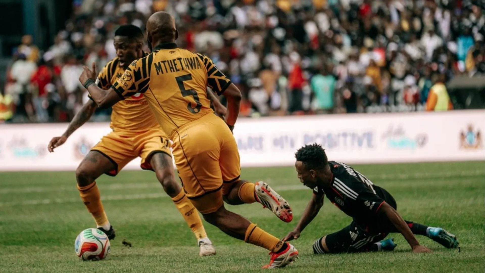 Sibongiseni Mthethwa of Kaizer Chiefs takes the ball away from Relebohile Mofokeng of Orlando Pirates in the Soweto Derby.