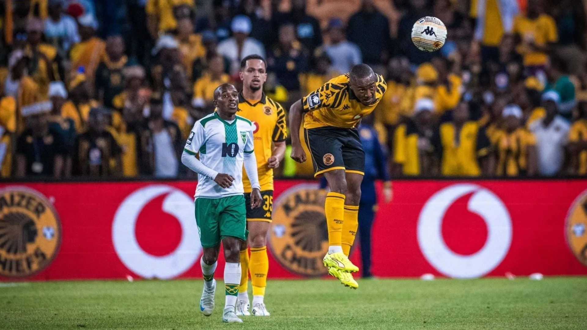 Lebohang Maboe heads the ball as Aden McCarthy looks on against Golden Arrows.