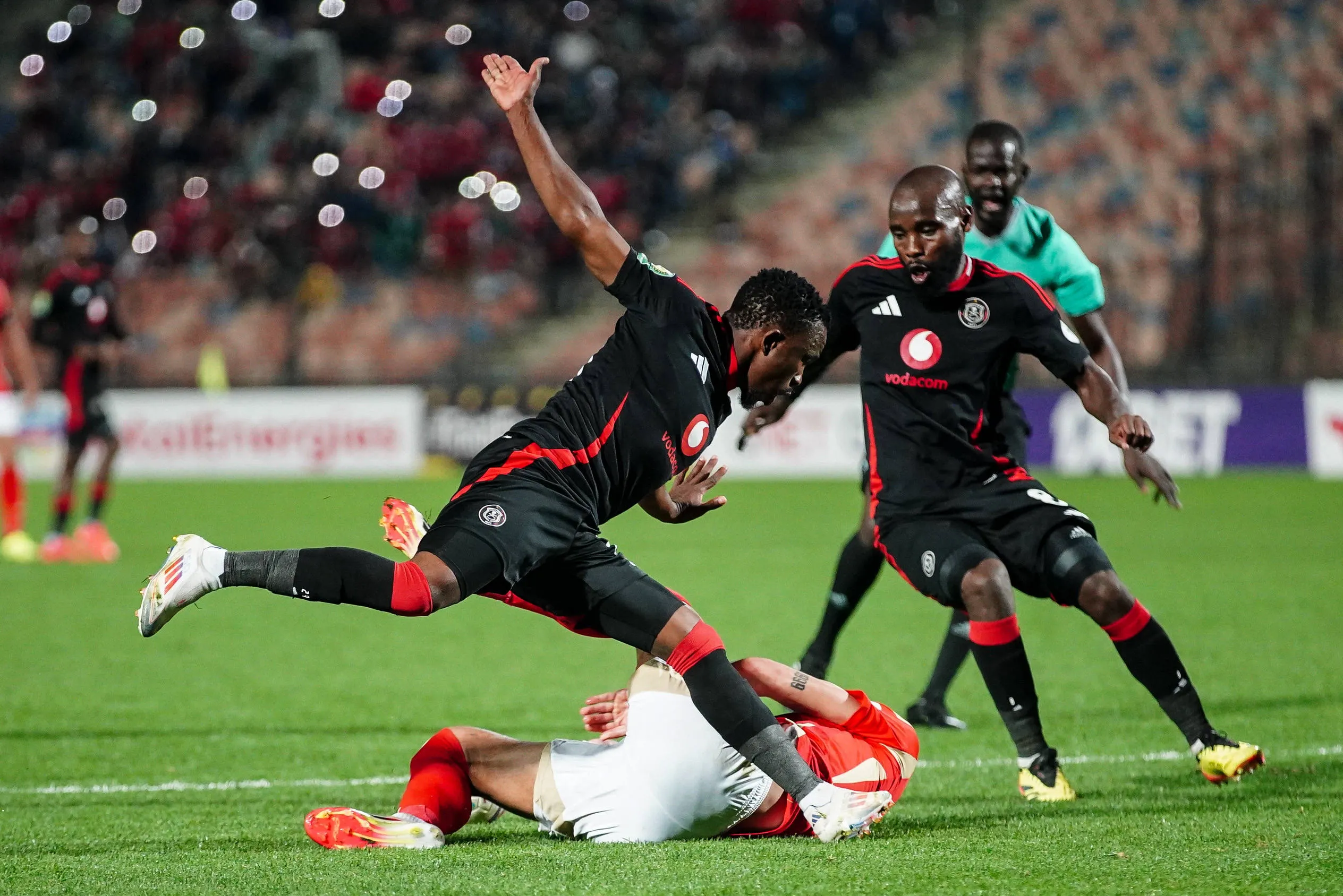 A picture of Orlando Pirates players in action against Al Ahly 